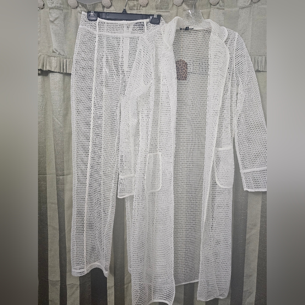 White jacket and pants set. Brand new. Size large.